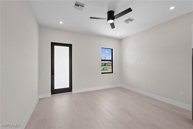 1201 E 7th St, Lehigh Acres, FL 33972 - spare room featuring light wood finished floors, ceiling fan, baseboards, and recessed lighting