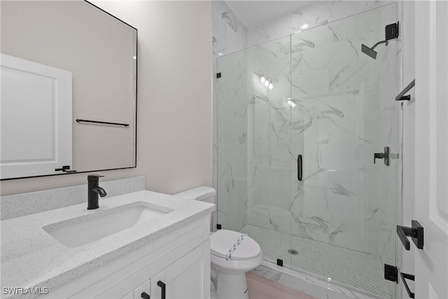 1201 E 7th St, Lehigh Acres, FL 33972 - bathroom featuring a marble finish shower, vanity, and toilet
