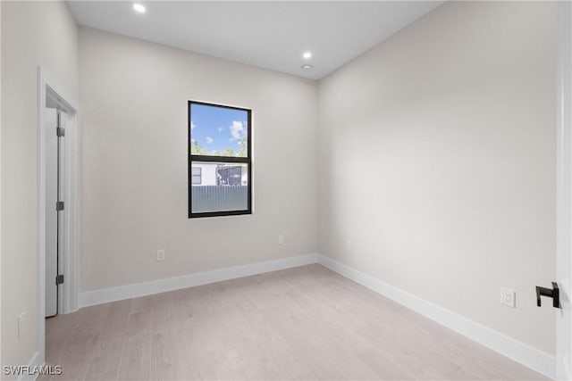 1201 E 7th St, Lehigh Acres, FL 33972 - empty room featuring light wood-style flooring, recessed lighting, and baseboards