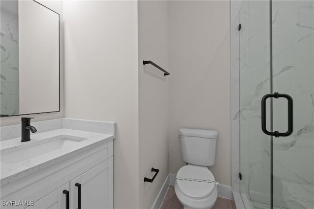 1201 E 7th St, Lehigh Acres, FL 33972 - full bath featuring vanity, toilet, a marble finish shower, and baseboards