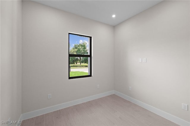 1201 E 7th St, Lehigh Acres, FL 33972 - spare room featuring light wood-type flooring, baseboards, and recessed lighting