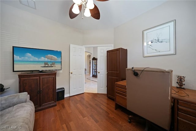 home office featuring ceiling fan and dark hardwood / wood-style flooring