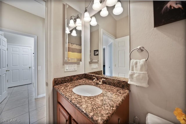 bathroom featuring tile patterned floors and vanity