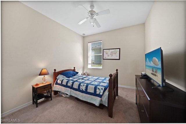 bedroom featuring ceiling fan and light carpet