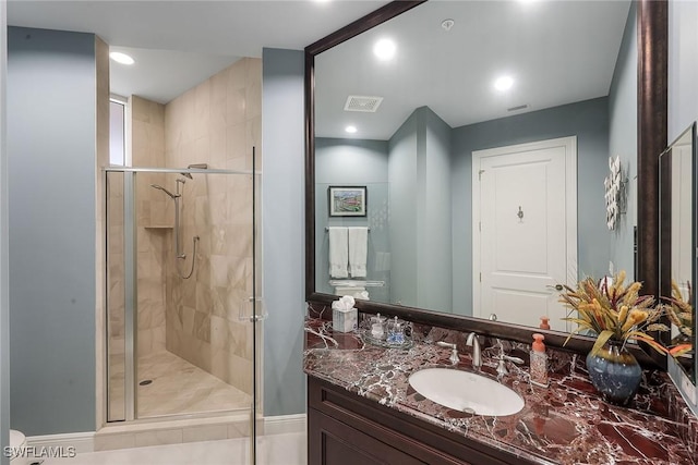 bathroom with vanity and an enclosed shower