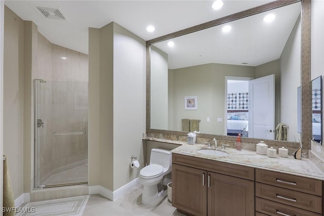 bathroom with tile patterned flooring, vanity, toilet, and a shower with door