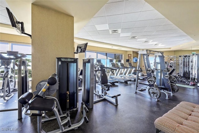 workout area featuring a drop ceiling