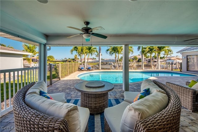 view of swimming pool featuring an outdoor hangout area, ceiling fan, and a patio area