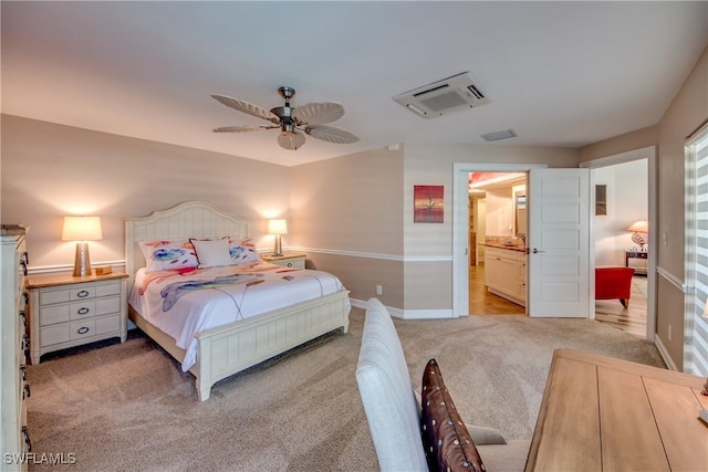 carpeted bedroom featuring connected bathroom and ceiling fan