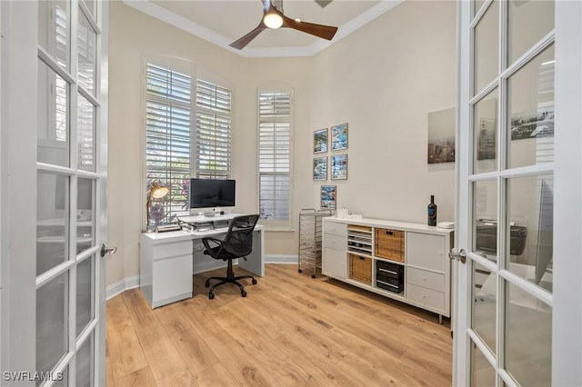 home office with crown molding, light hardwood / wood-style floors, french doors, and ceiling fan