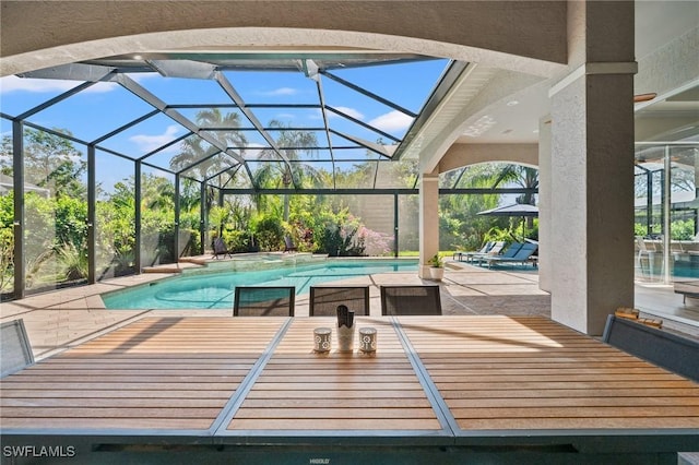 view of pool featuring a lanai and a patio area