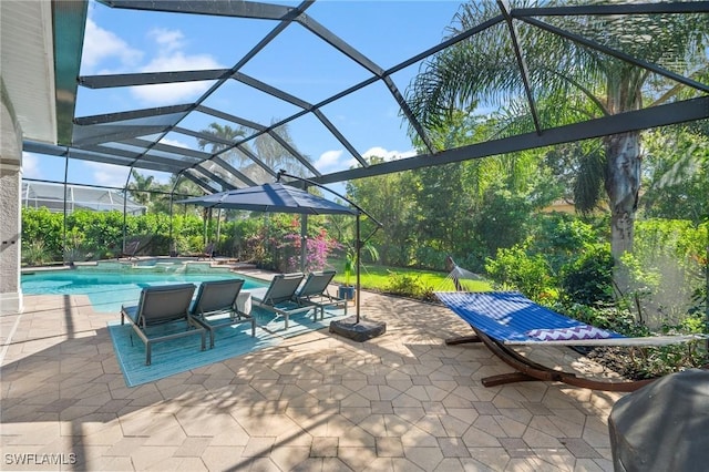 view of patio featuring area for grilling and a lanai