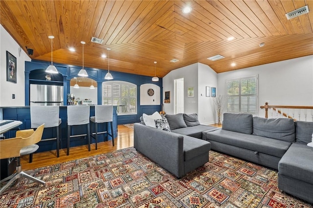 living room with lofted ceiling, wood-type flooring, and wooden ceiling