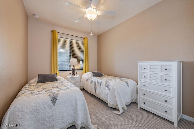 bedroom with ceiling fan and light colored carpet