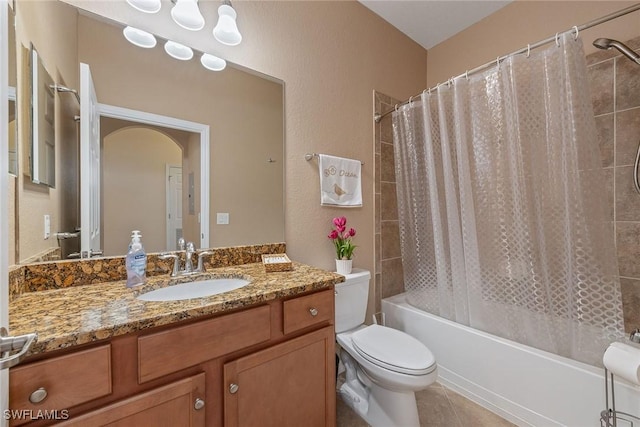 full bathroom with tile patterned floors, vanity, toilet, and shower / bath combo with shower curtain