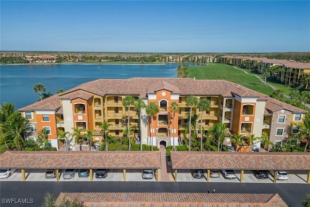 birds eye view of property with a water view