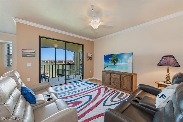 tiled living room with ceiling fan and crown molding