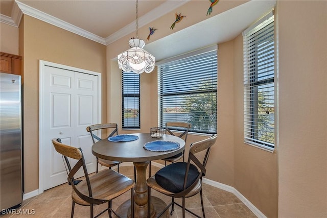 tiled dining room featuring crown molding