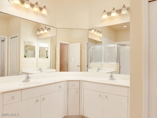 bathroom featuring walk in shower and vanity