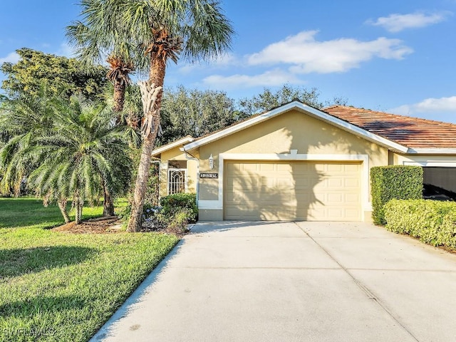 single story home with a front lawn and a garage