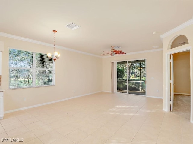 spare room with ceiling fan with notable chandelier, light tile patterned flooring, and ornamental molding