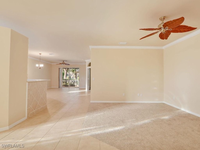 unfurnished room with light tile patterned flooring, an inviting chandelier, and ornamental molding