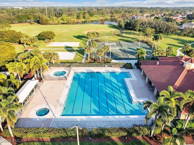 view of pool with a water view