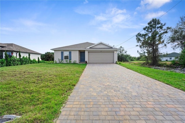 view of front facade with a garage and a front lawn