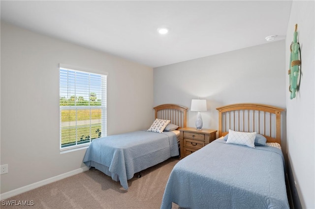 bedroom with light colored carpet