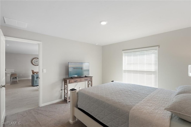 bedroom featuring light colored carpet