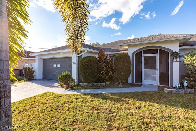 single story home with a garage and a front yard