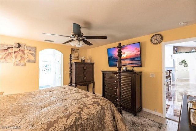 bedroom featuring tile patterned floors and ceiling fan