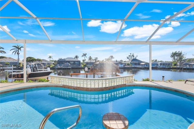 view of swimming pool featuring a water view