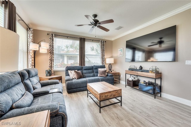 living room featuring crown molding, ceiling fan, and light wood-type flooring