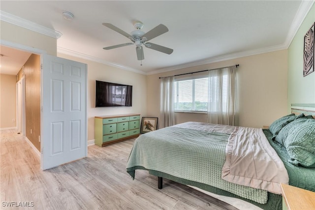 bedroom featuring crown molding, ceiling fan, and light hardwood / wood-style flooring