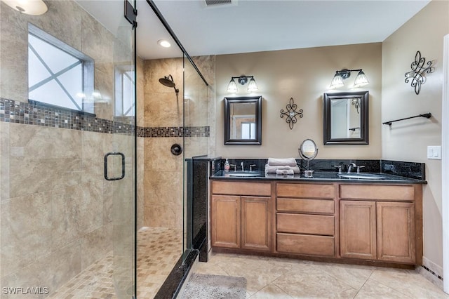 bathroom with walk in shower and vanity