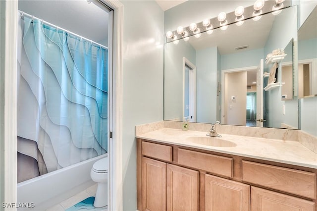 full bathroom with tile patterned floors, vanity, toilet, and shower / tub combo