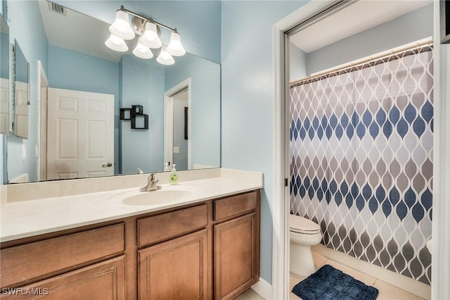 bathroom featuring a shower with shower curtain, vanity, toilet, and tile patterned flooring