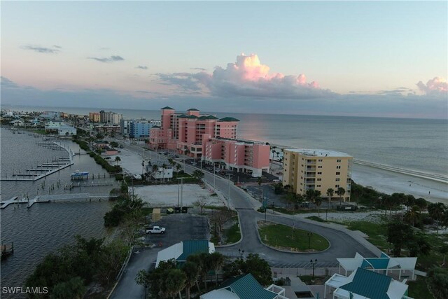 aerial view at dusk with a water view