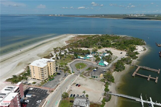 drone / aerial view with a view of the beach and a water view