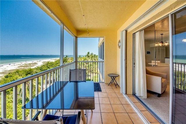 balcony with a view of the beach and a water view