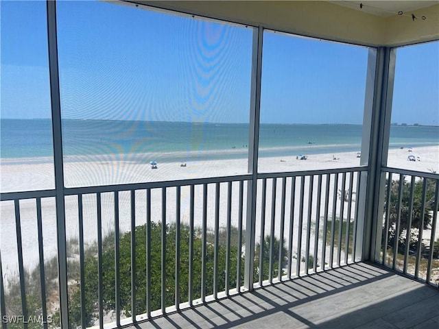 100 Estero Blvd Unit 434, Fort Myers Beach, FL 33931 - unfurnished sunroom with view of water and beach