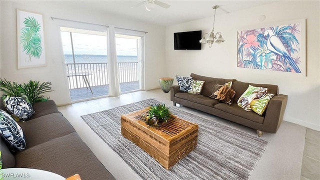 100 Estero Blvd Unit 434, Fort Myers Beach, FL 33931 - living room featuring a ceiling fan and a chandelier