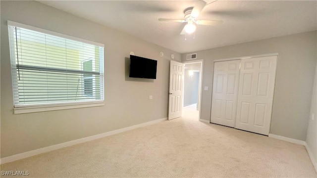 100 Estero Blvd Unit 434, Fort Myers Beach, FL 33931 - unfurnished bedroom with carpet flooring, baseboards, a closet, and ceiling fan