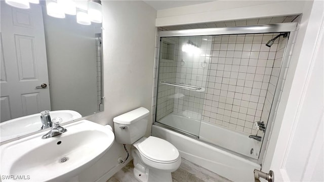 100 Estero Blvd Unit 434, Fort Myers Beach, FL 33931 - full bath featuring combined bath / shower with glass door, toilet, and a sink