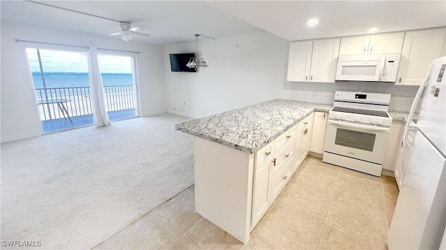 100 Estero Blvd Unit 434, Fort Myers Beach, FL 33931 - kitchen with white appliances, a peninsula, ceiling fan, light stone countertops, and white cabinetry