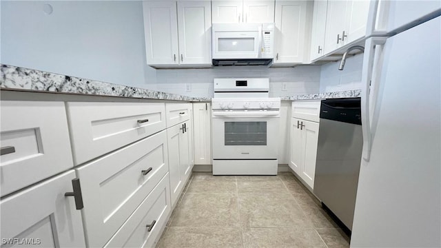 100 Estero Blvd Unit 434, Fort Myers Beach, FL 33931 - kitchen featuring white appliances, white cabinetry, light countertops, and decorative backsplash
