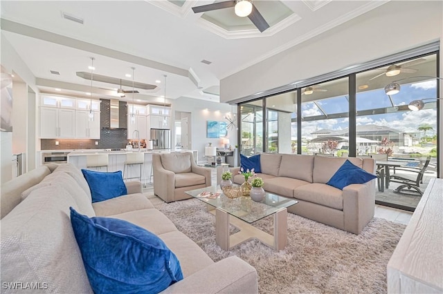 living room featuring beamed ceiling, crown molding, coffered ceiling, and light tile patterned floors