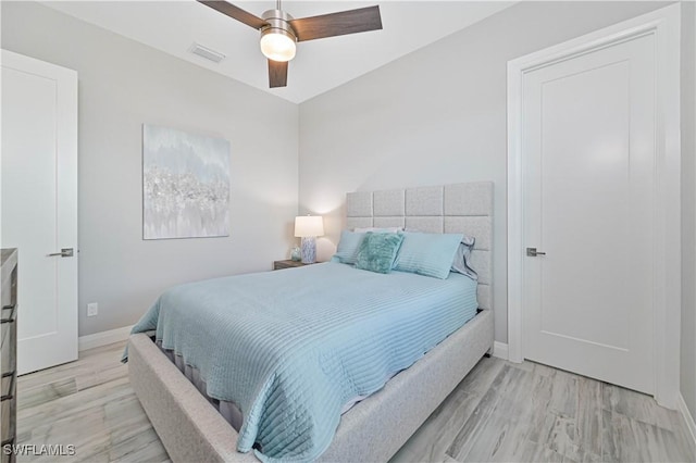 bedroom featuring ceiling fan and light hardwood / wood-style floors