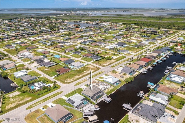 bird's eye view with a water view